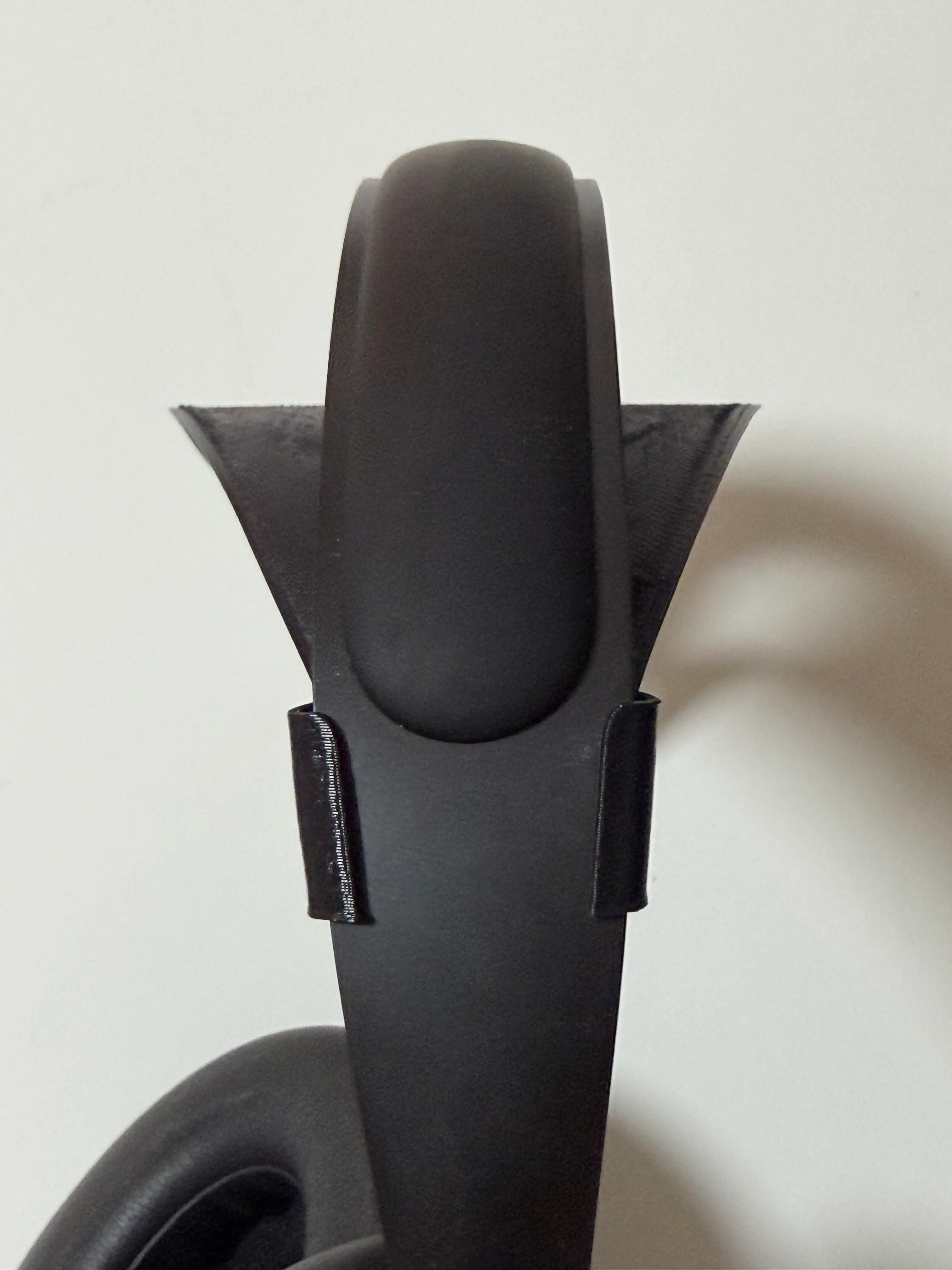 Side view showing the add-on band riding beneath the stock headband