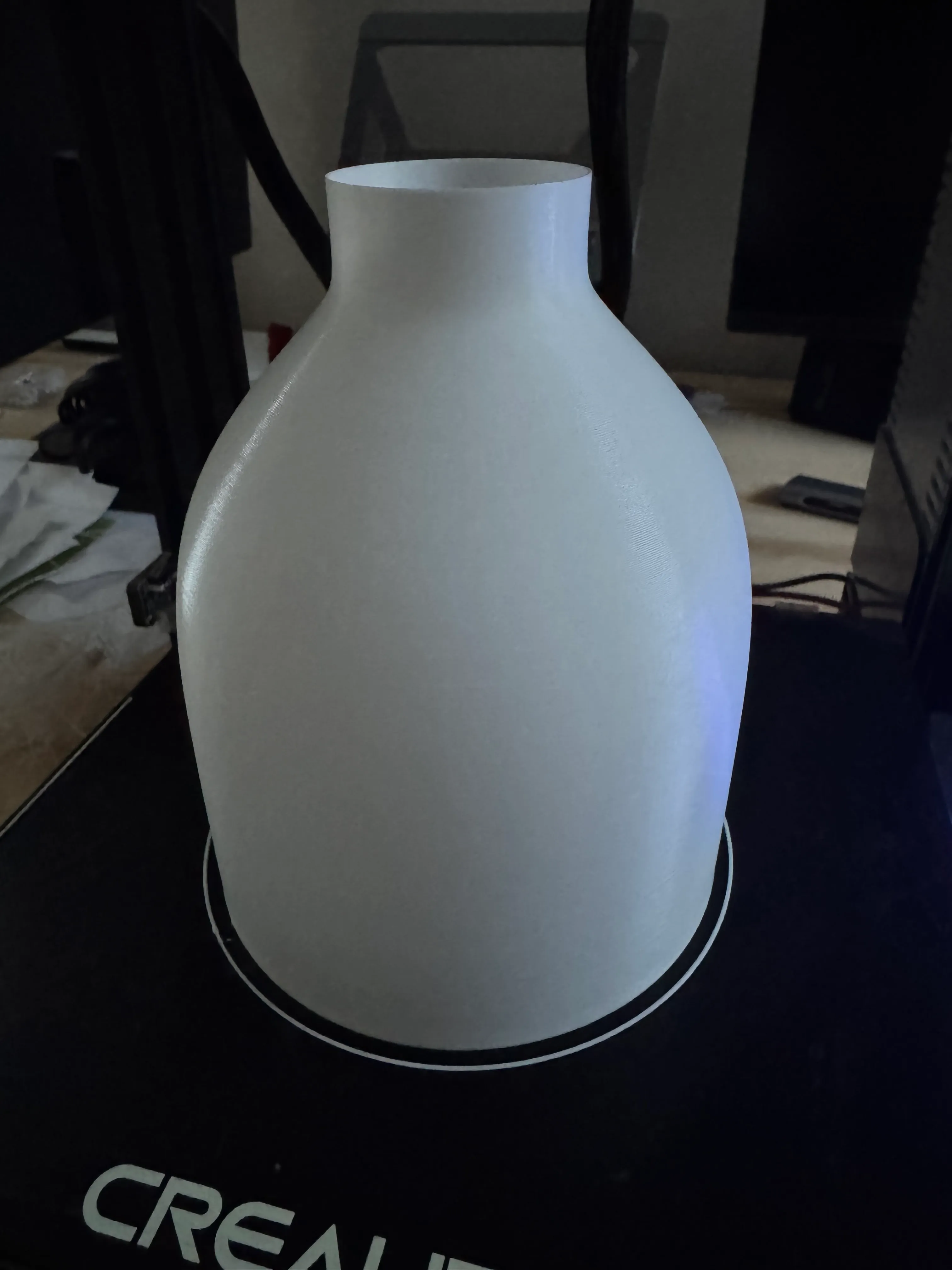 Test-fitting the printed shade against the lamp frame